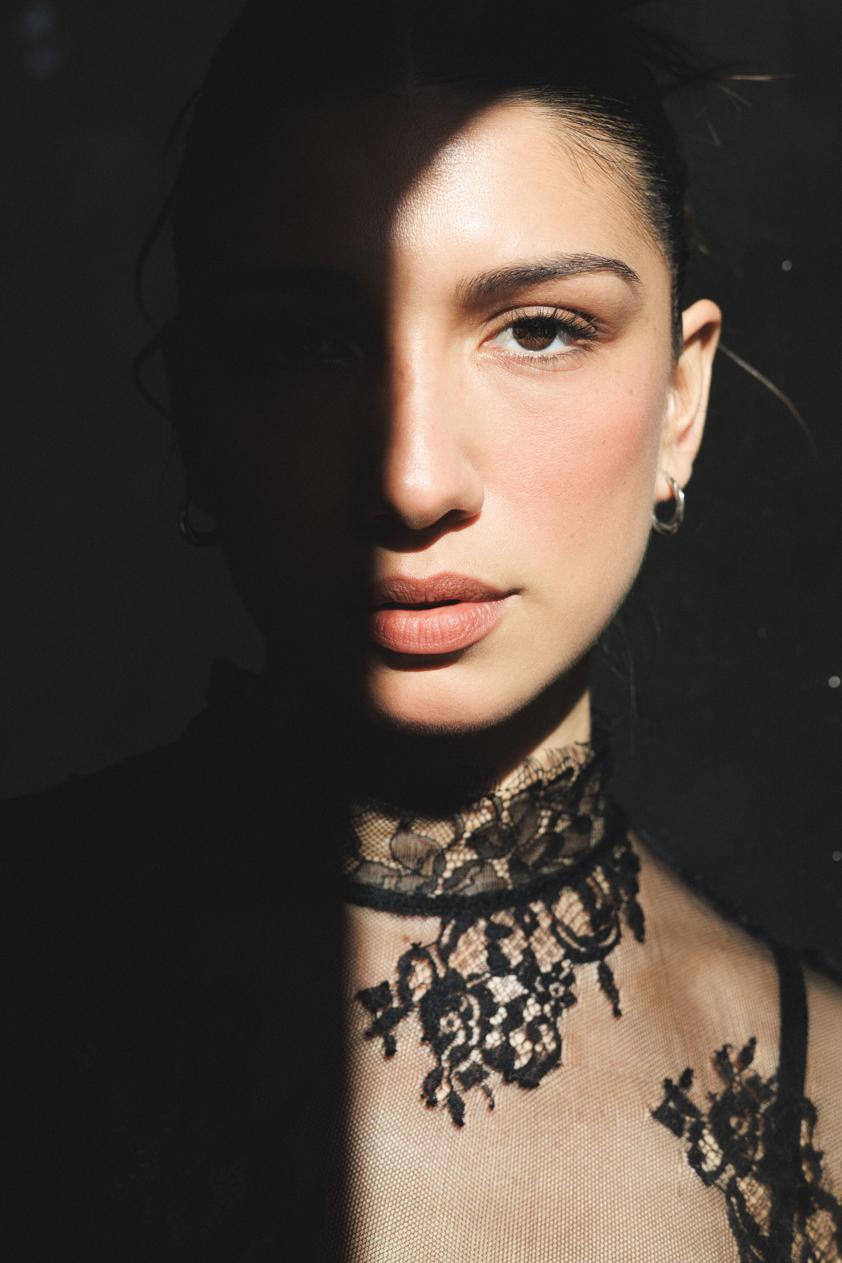 Shadow and Lace: A Chiaroscuro Portrait